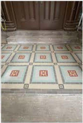 Encaustic tile flooring in the entryway after restoration